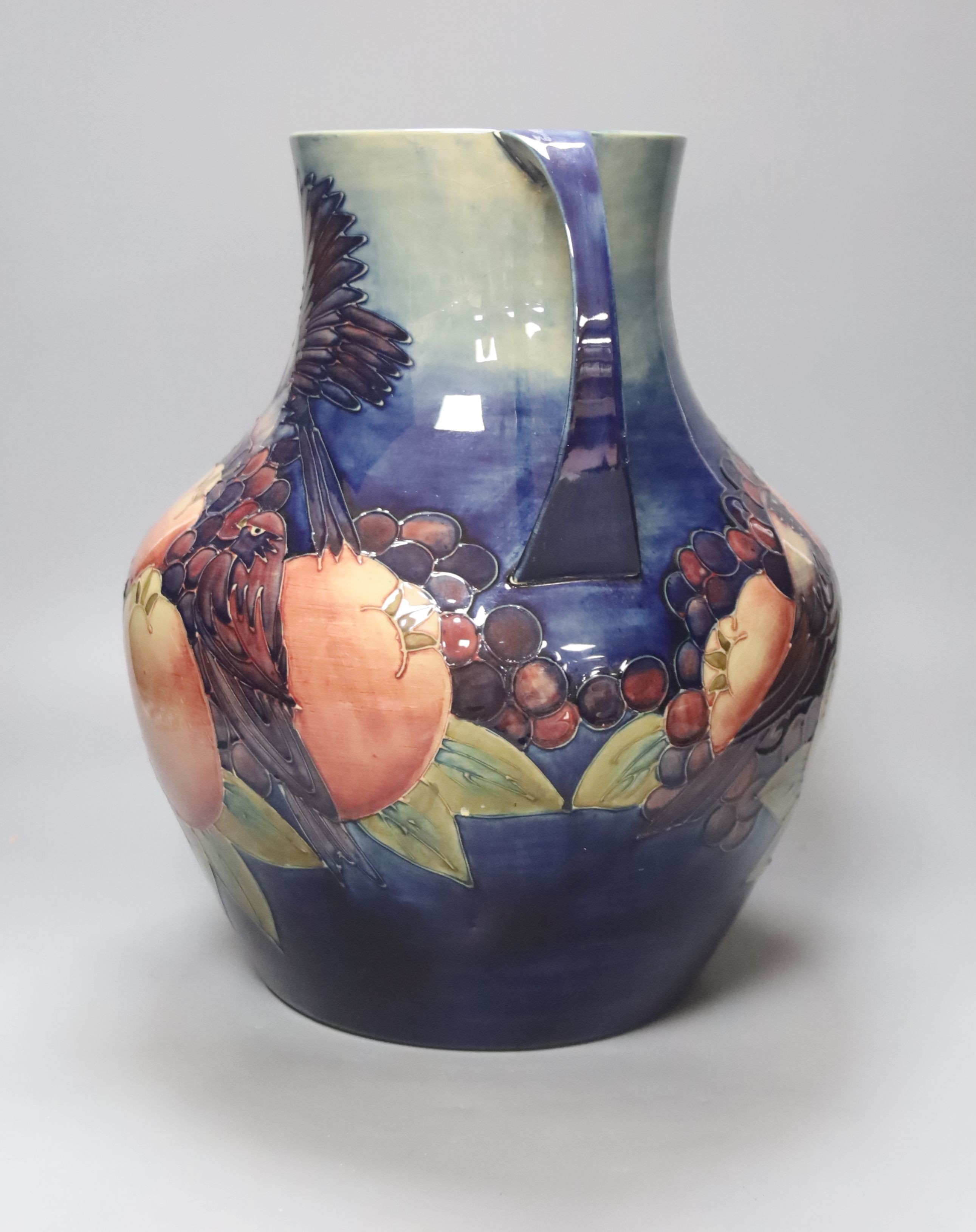 A large Moorcroft finches and fruit two handled vase, height 36cm